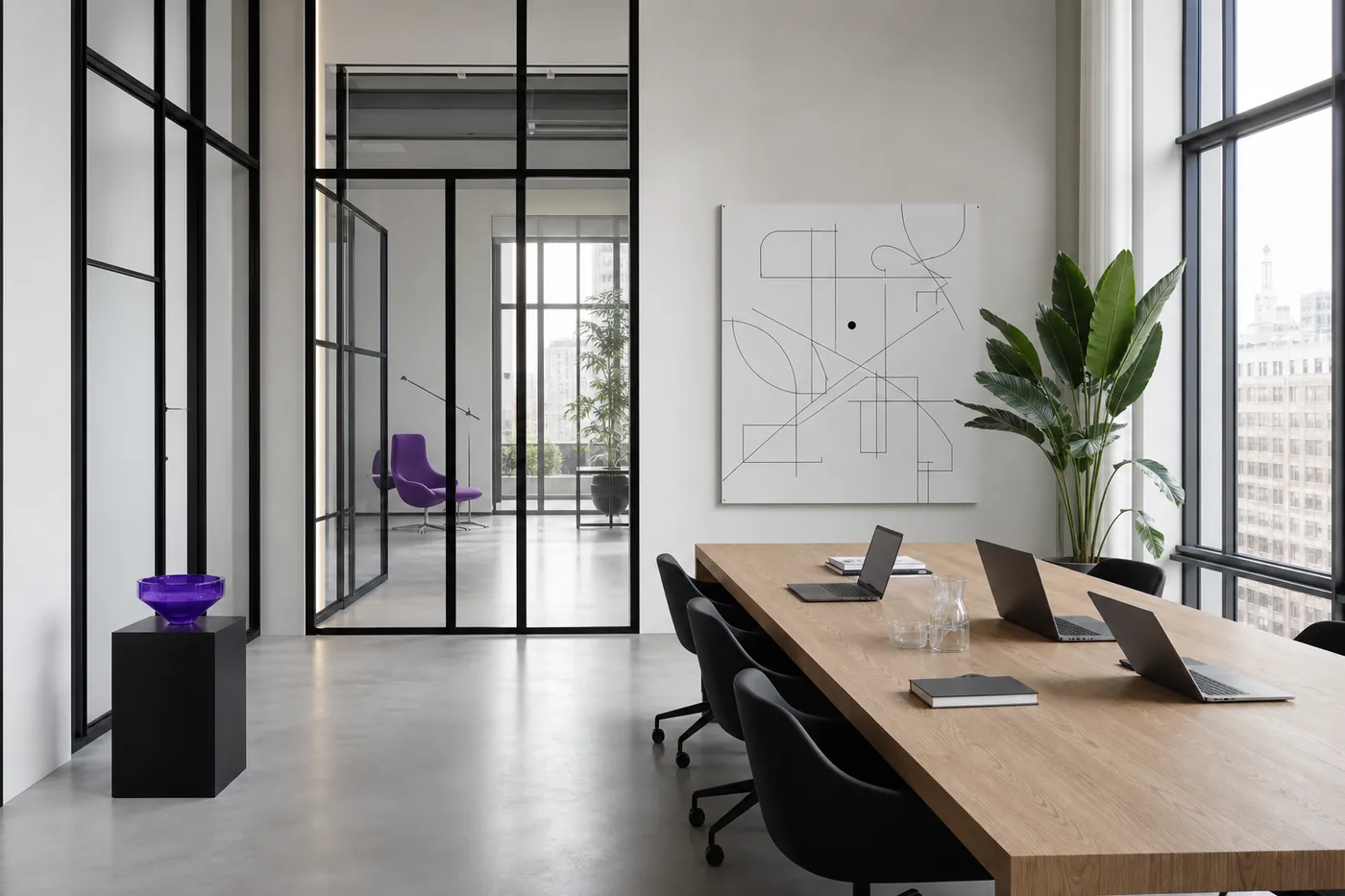Minimalist Berlin law-firm studio: exposed concrete, black-framed glass partitions, an oak table with laptops and a violet accent
